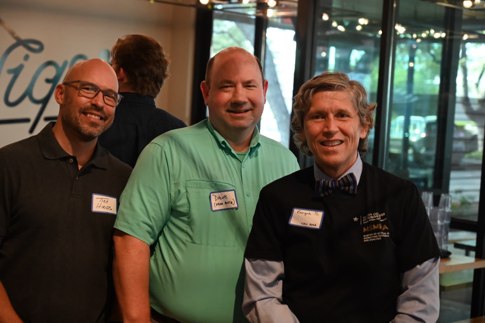 AMA Austin members talking at a community event