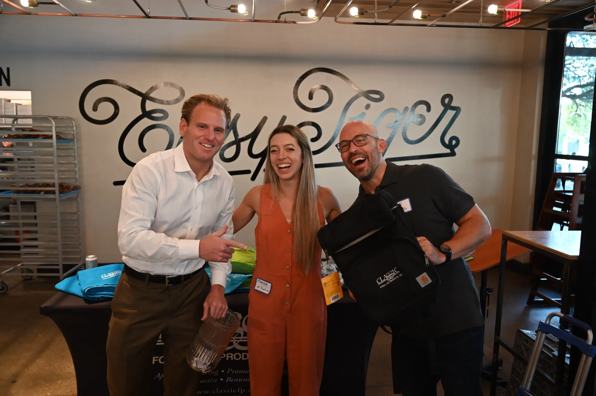 Marketers laughing together at Easy Tiger during a Marketing Morning