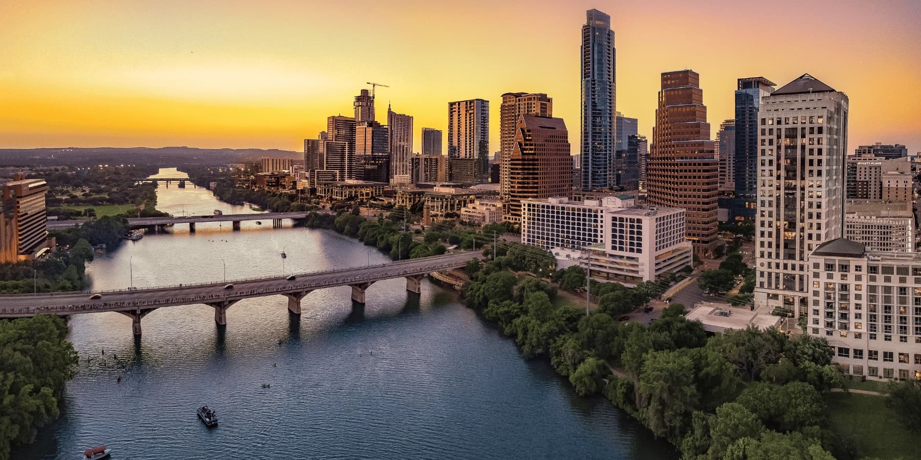 The Austin, Texas skyline over Lady Bird Lake at sunset